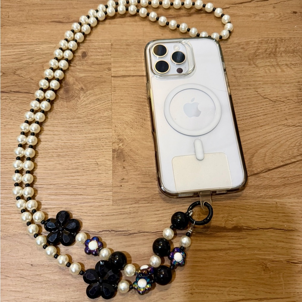 Elegant White and Black Phone Chain with Pearl Strap